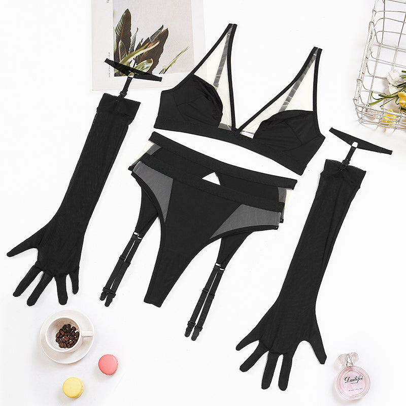 Black mesh lingerie pieces laid flat: bra, garter thong, and long gloves