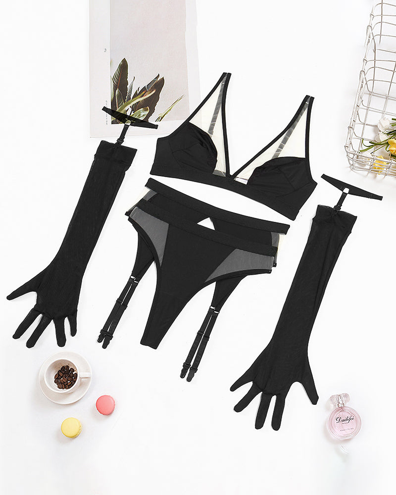 Exotic black mesh lingerie set with gloves, designed for a confident and sensual look.