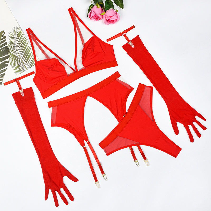 Red strappy lingerie set with fingerless gloves, bra, panties, and garter straps