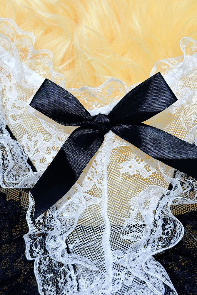 Maid dress lace bodice close-up with large black satin bow and white floral lace