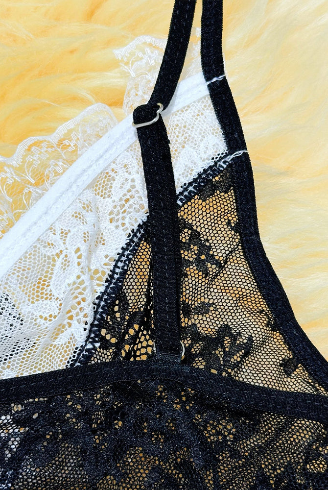 Sheer black lace garter with white lace trim and adjustable strap