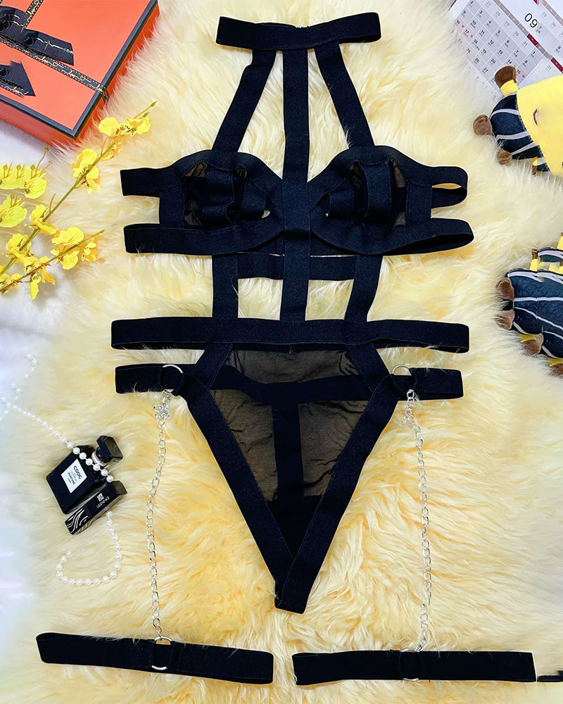 Black plus size lingerie set with strappy cut-out design and chain details