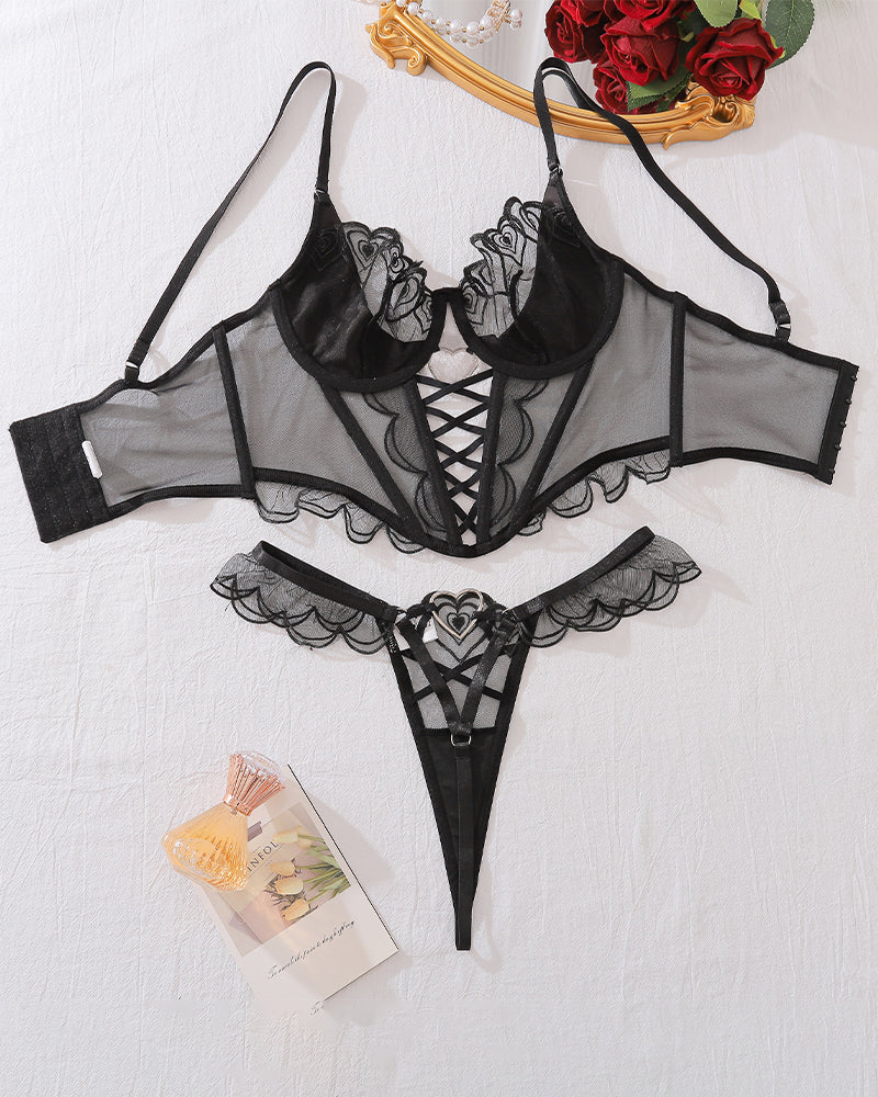 Black heart design lingerie set: bustier and thong with lace and metal details
