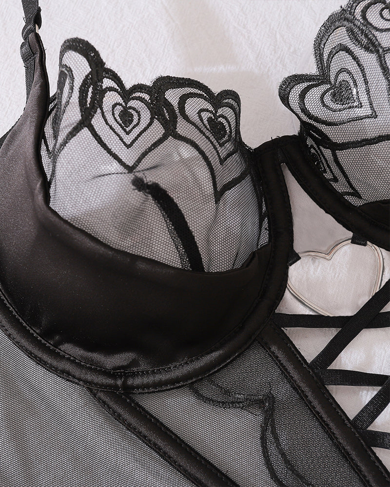 Black heart design bustier with lace and metal details from a lingerie set