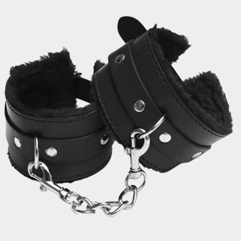 Black plush leather handcuffs with silver chain, perfect for role play and intimate moments.