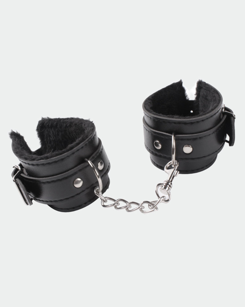 Black plush leather handcuffs with silver chain for role play and intimate moments