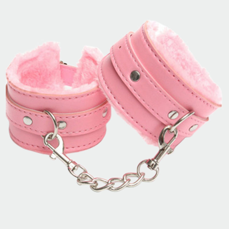 Pink plush leather handcuffs with silver chain, perfect for role play and intimate moments.