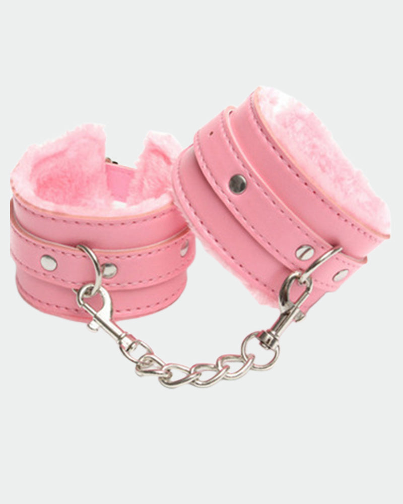 Pink plush leather handcuffs with silver chain, perfect for role play and intimate moments.