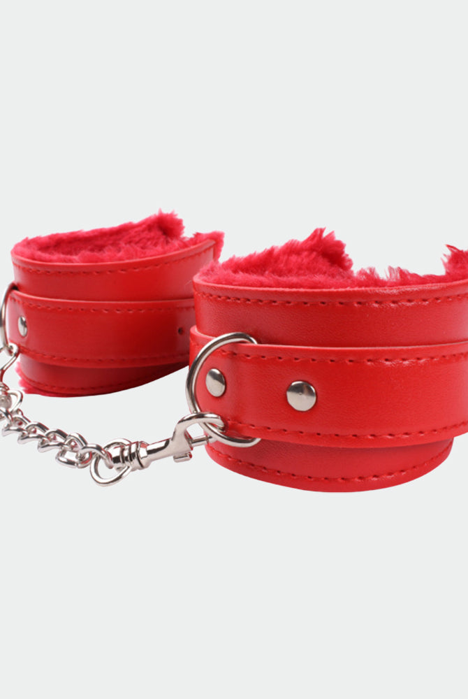 Red plush leather handcuffs with silver chain, perfect for role play and intimate moments