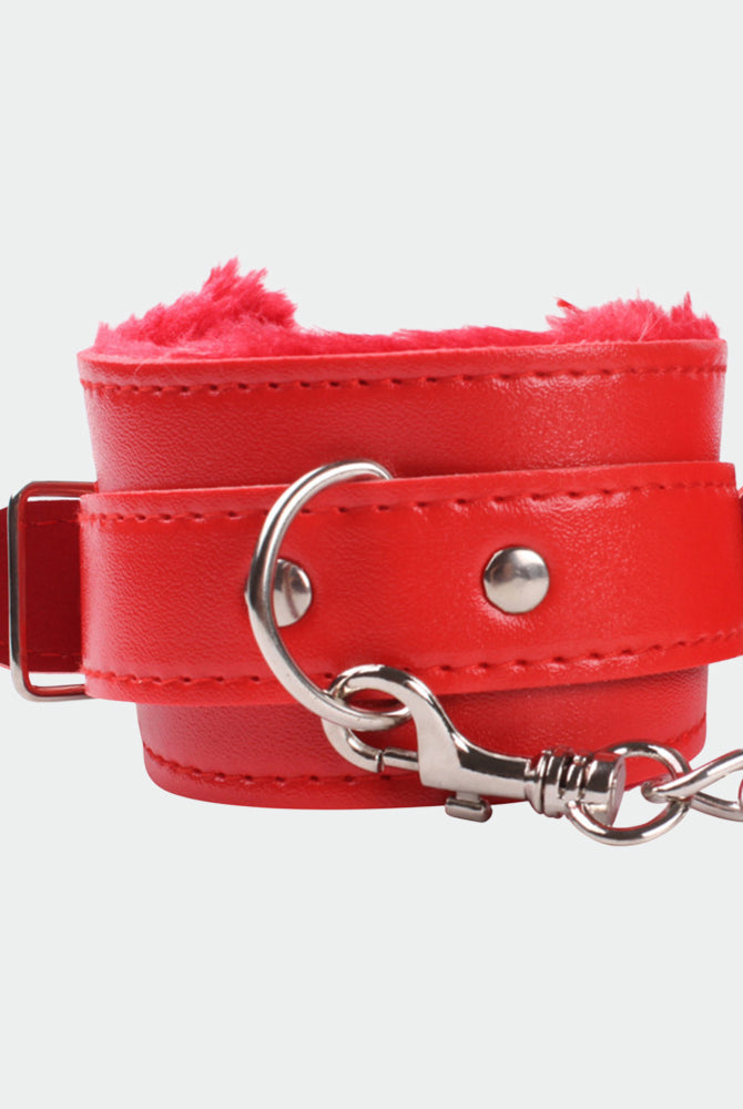 Red leather wrist cuffs with plush interior and silver hardware for intimate role play