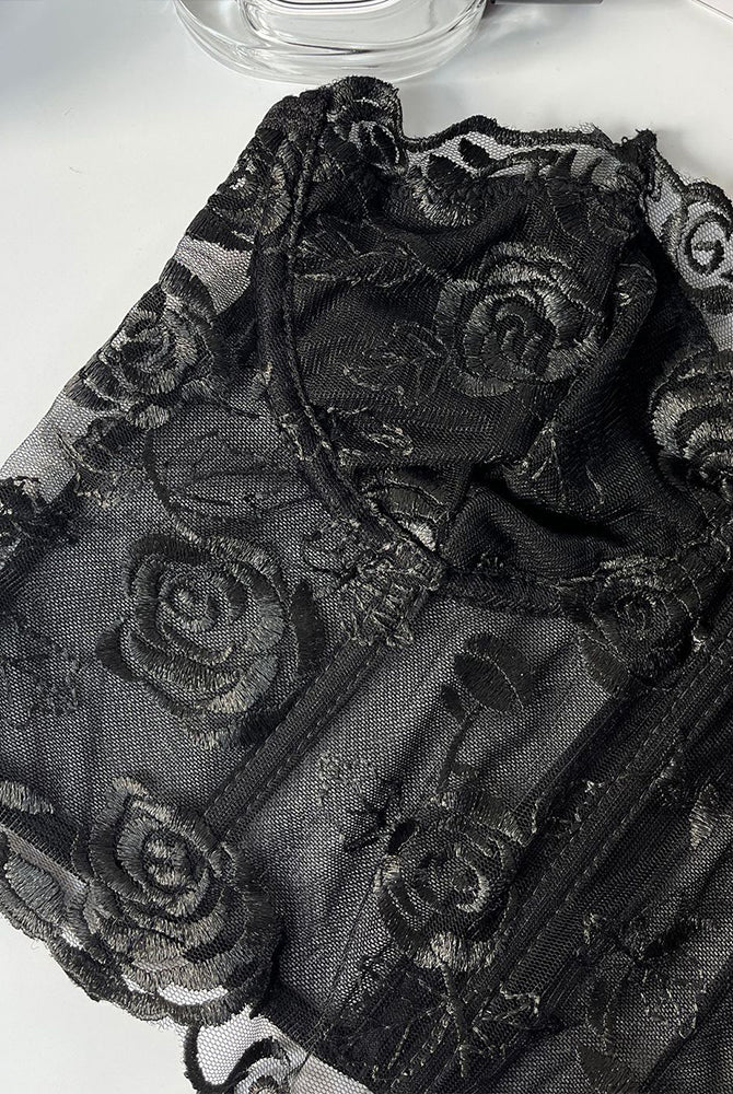 Black floral strapless mesh bustier with rose embroidery and boning for elegant support.