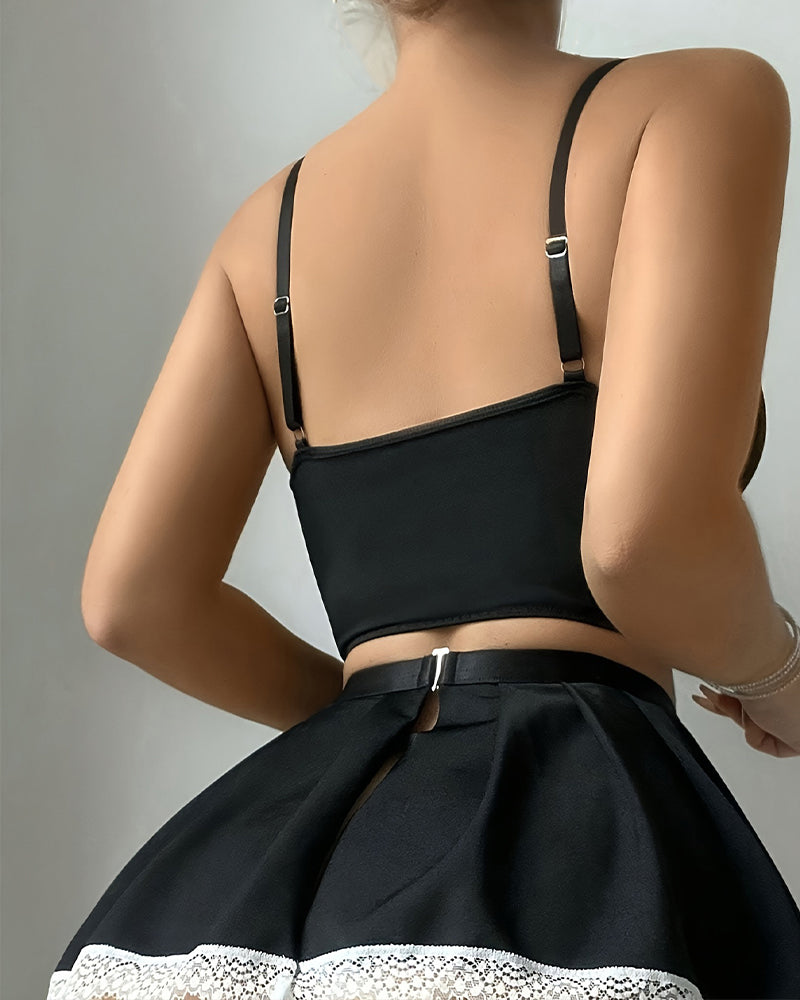 Black Exotic Maid Lingerie set, featuring corset top, skirt with lace trim, and adjustable straps.