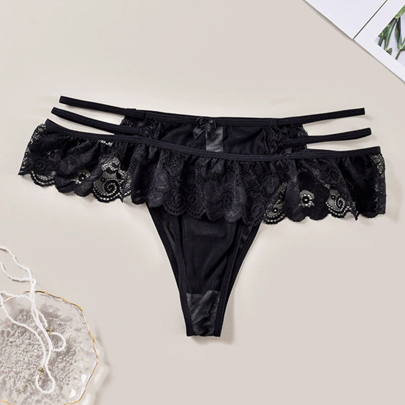 Black lace low waist triangle panties. Sexy lingerie with cut-out and sheer details.
