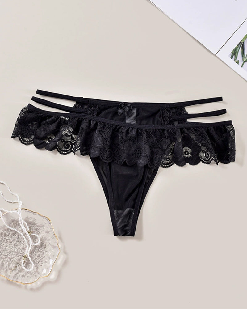 Black lace low waist triangle panties. Sexy lingerie with cut-out and sheer details.
