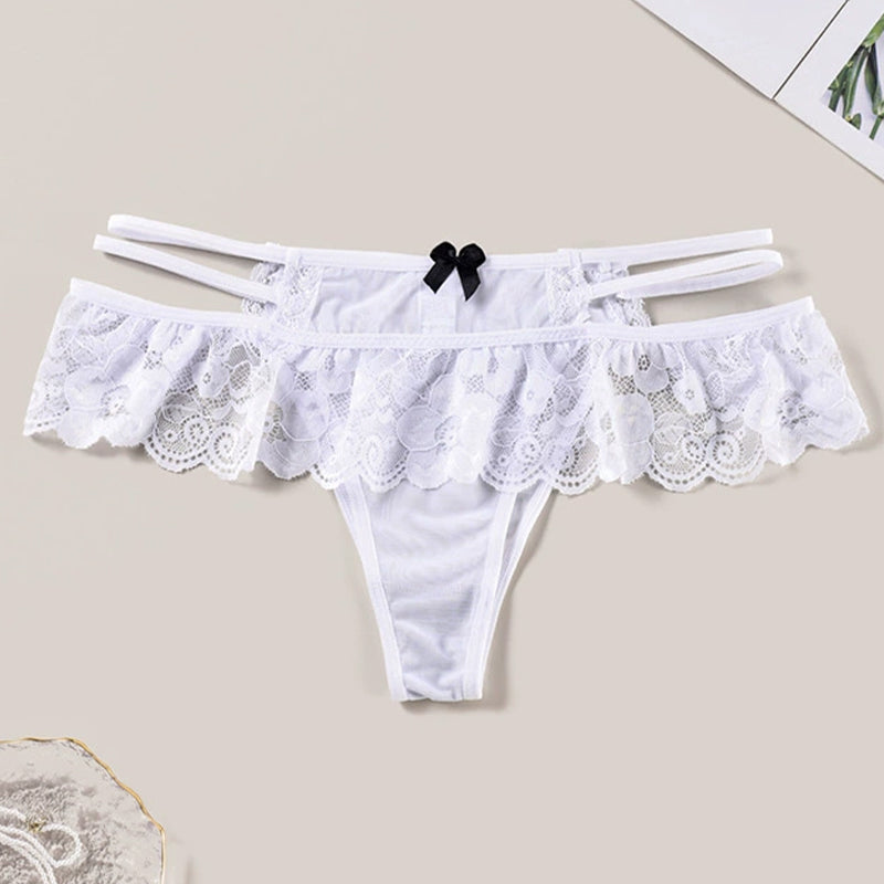 White lace low waist triangle panties with cut-out details and a black bow, perfect for a sexy look.