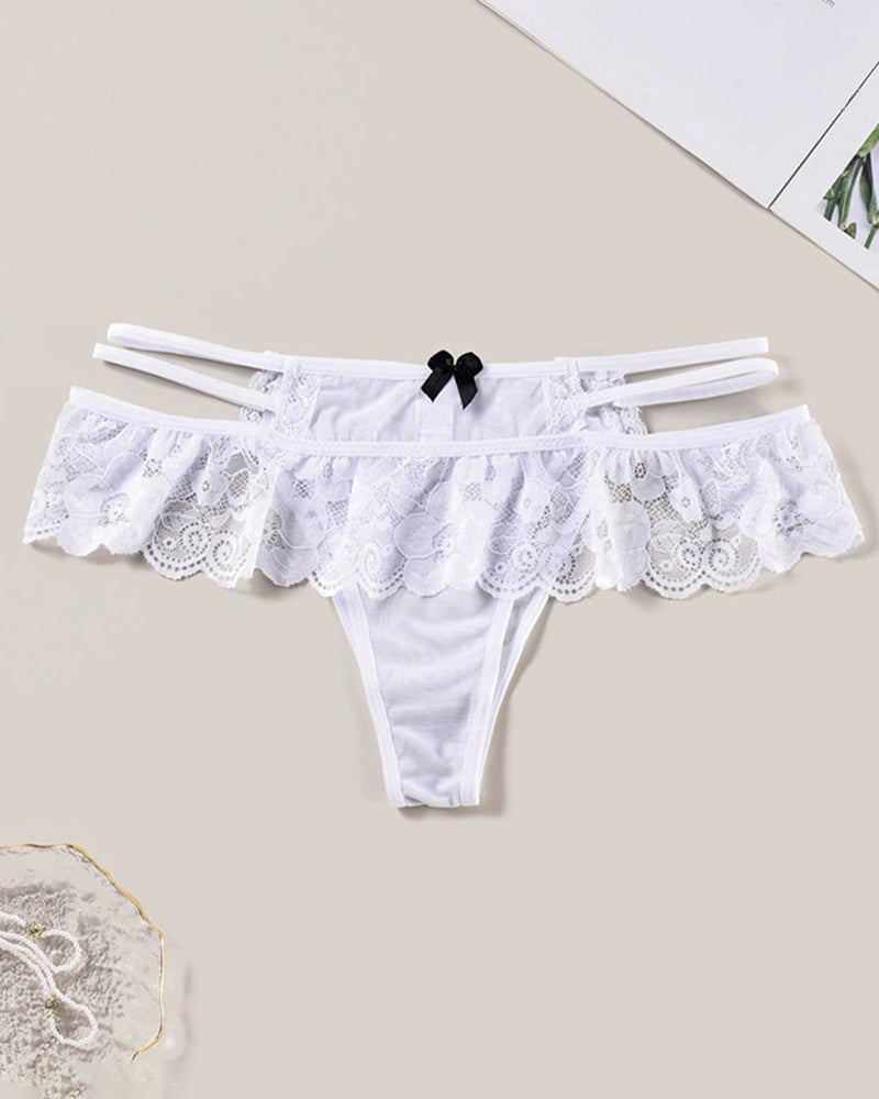 White lace low waist triangle panties with cut-out details and a black bow, perfect for a sexy look.
