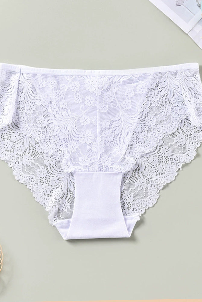White lace briefs. Low rise, sheer lace sides. Sexy and comfortable lingerie. Floral lace design.