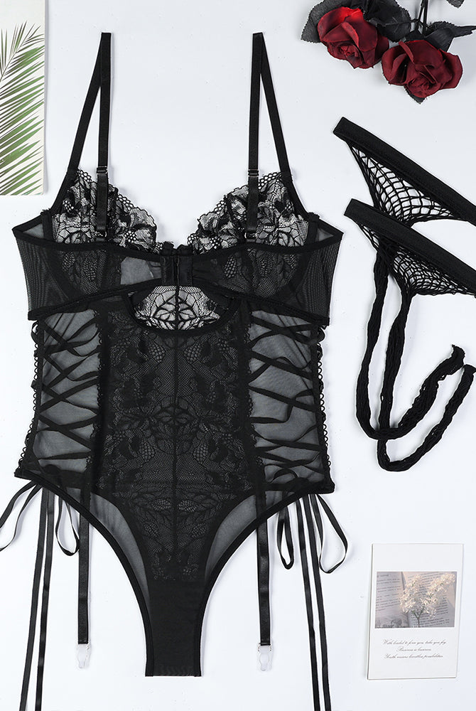 Black lace bodysuit with criss-cross detail and stockings. Sexy lingerie set.