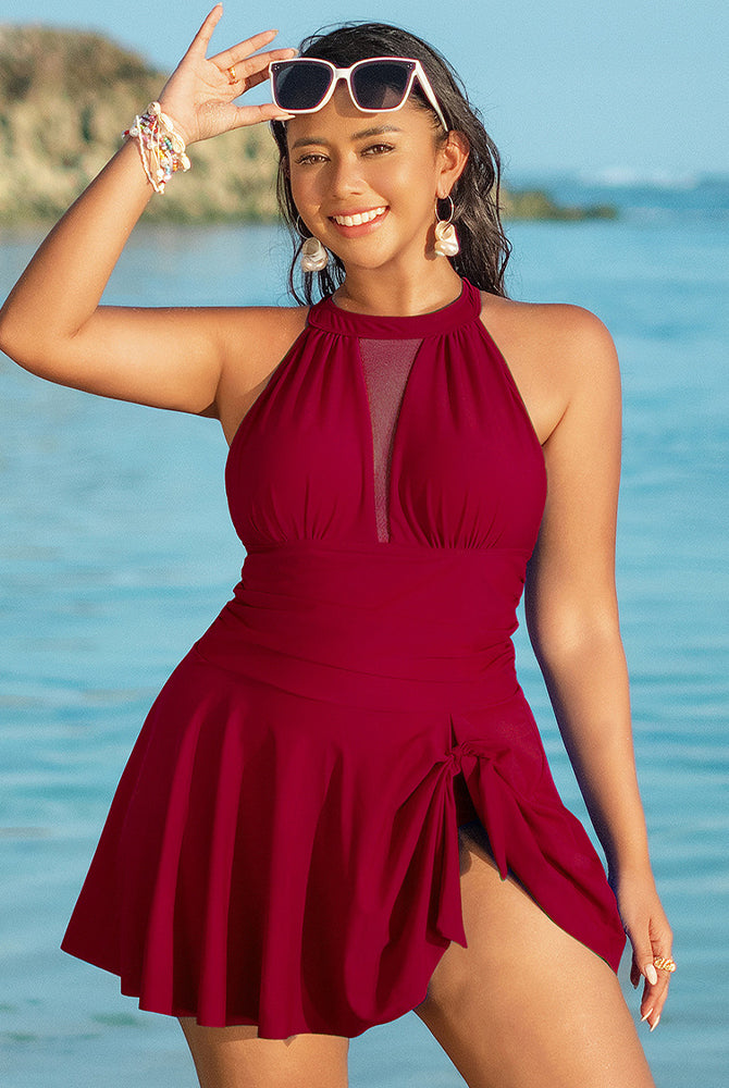 Burgundy plus size halter neck swim dress with skirted bottom and mesh detail, flattering fit