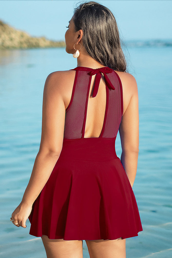 Burgundy plus size halter neck swim dress with skirted bottom and mesh back detail