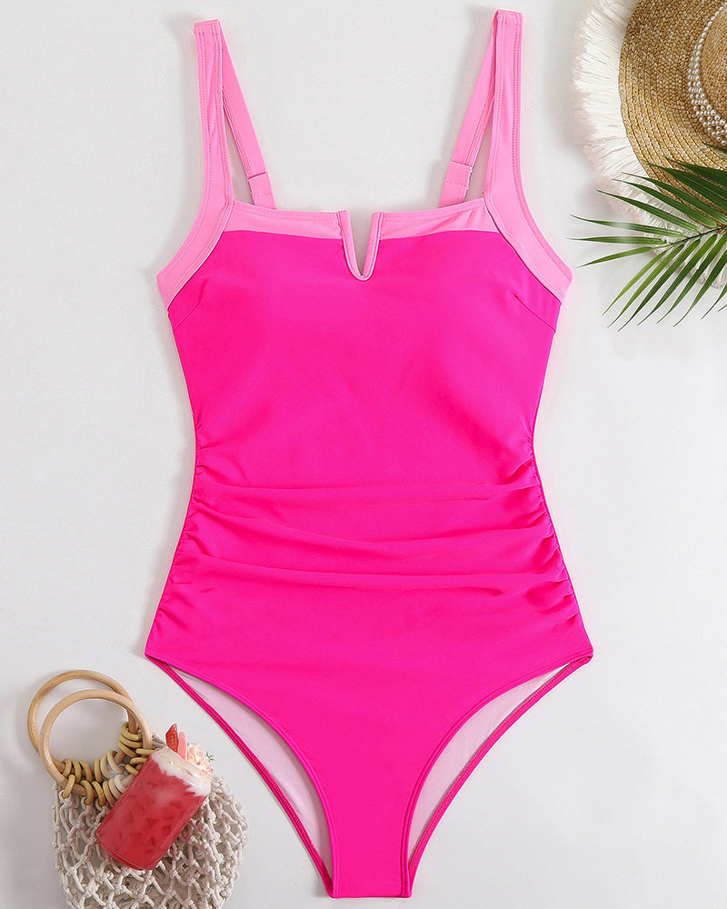 Pink one-piece swimsuit with square neckline, light pink trim, hugging curves, elegant and stunning
