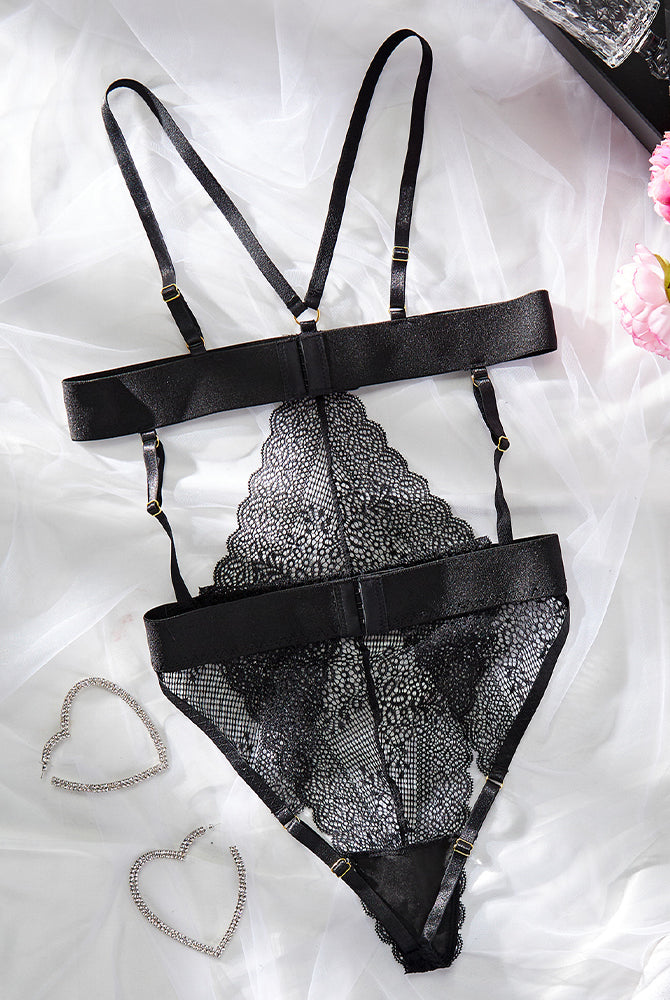 Black lace cupless bodysuit with halter neck and garter belt. Sexy lingerie. Polyester and spandex.