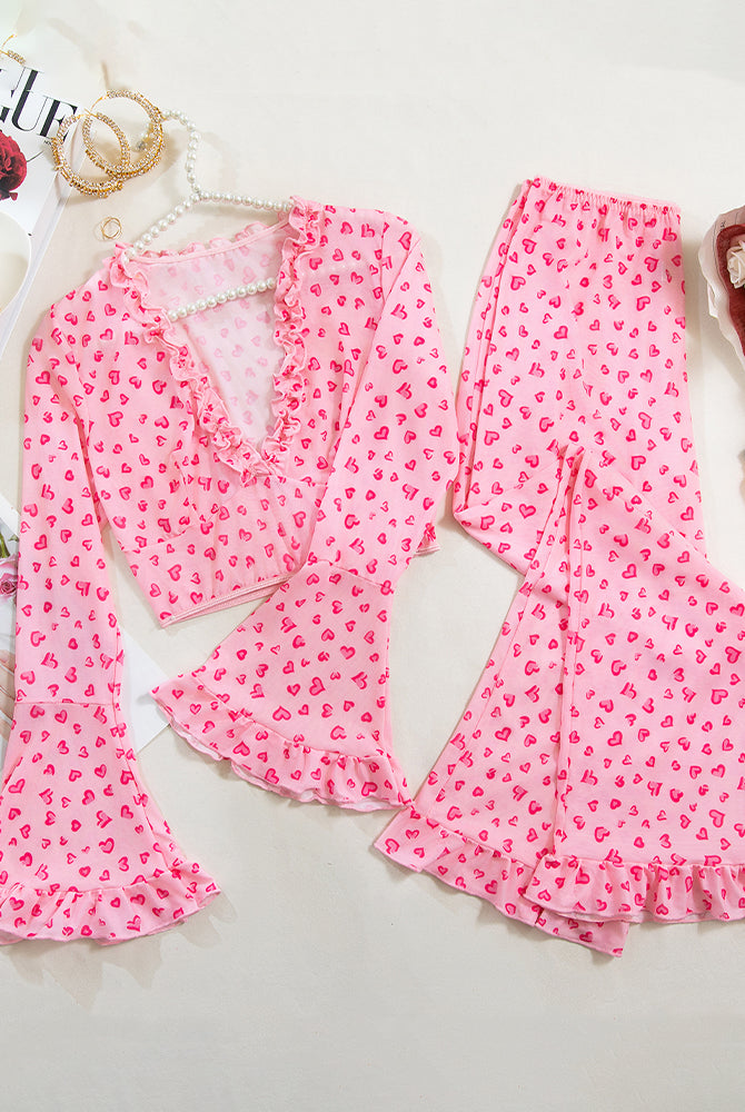 Long-sleeved pink heart print pajama set with ruffled top and pants for women