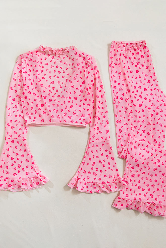 Pink heart print pajama set with ruffled top and bell sleeves, comfortable sleepwear for women