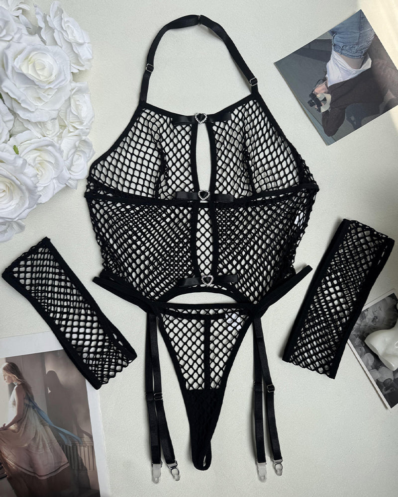 Black fishnet lingerie set with heart accents, garter belt, and arm cuffs. See-through lingerie.