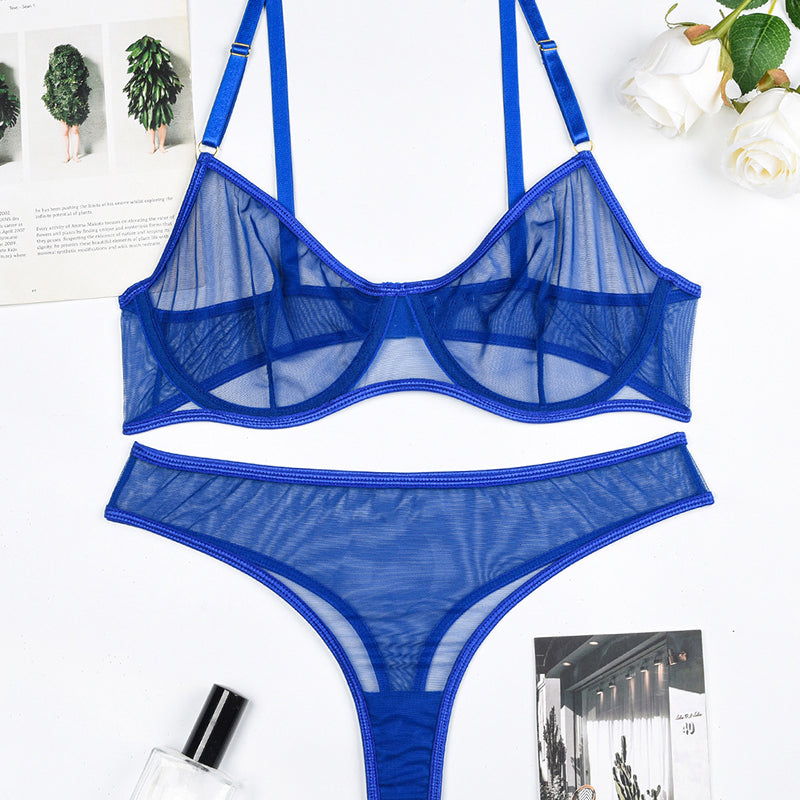 Blue sheer mesh underwire bra and thong panty set, laid flat