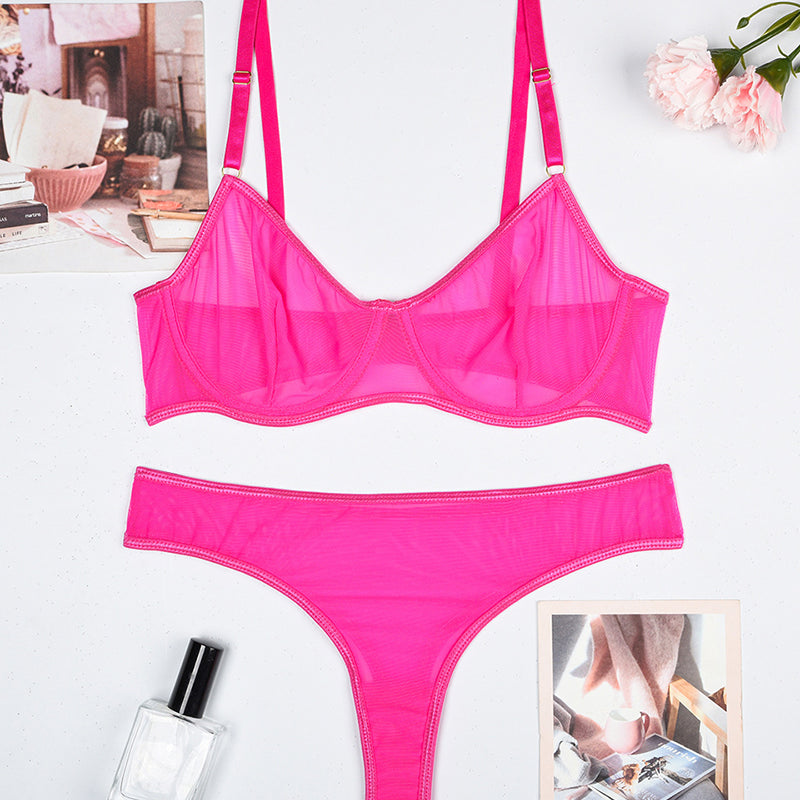 Pink sheer mesh underwire bra and thong panty set, flat lay