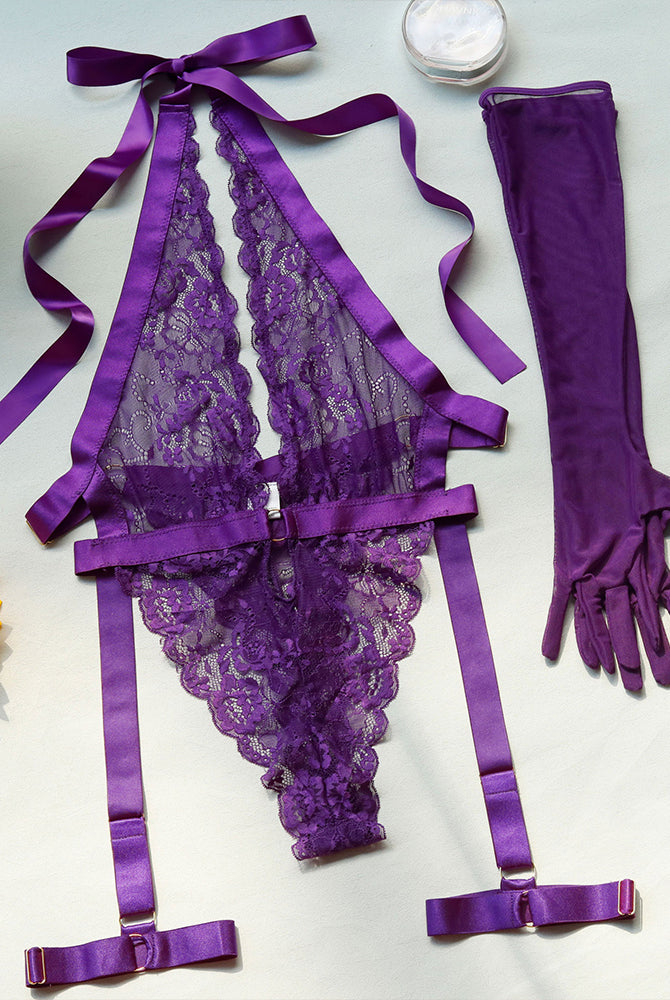 Purple lace halter bodysuit with gloves. Deep V-neck, floral lace design, and satin details.