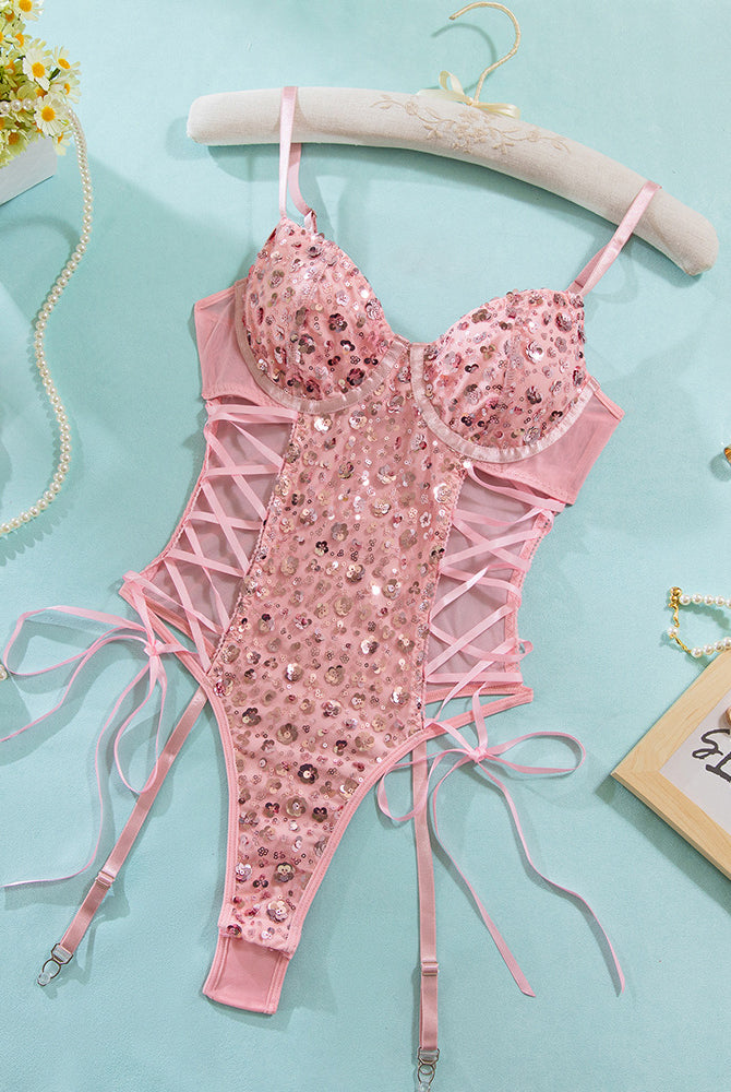 Pink sequin mesh erotic butterfly bodysuit with lace-up details, adjustable straps.