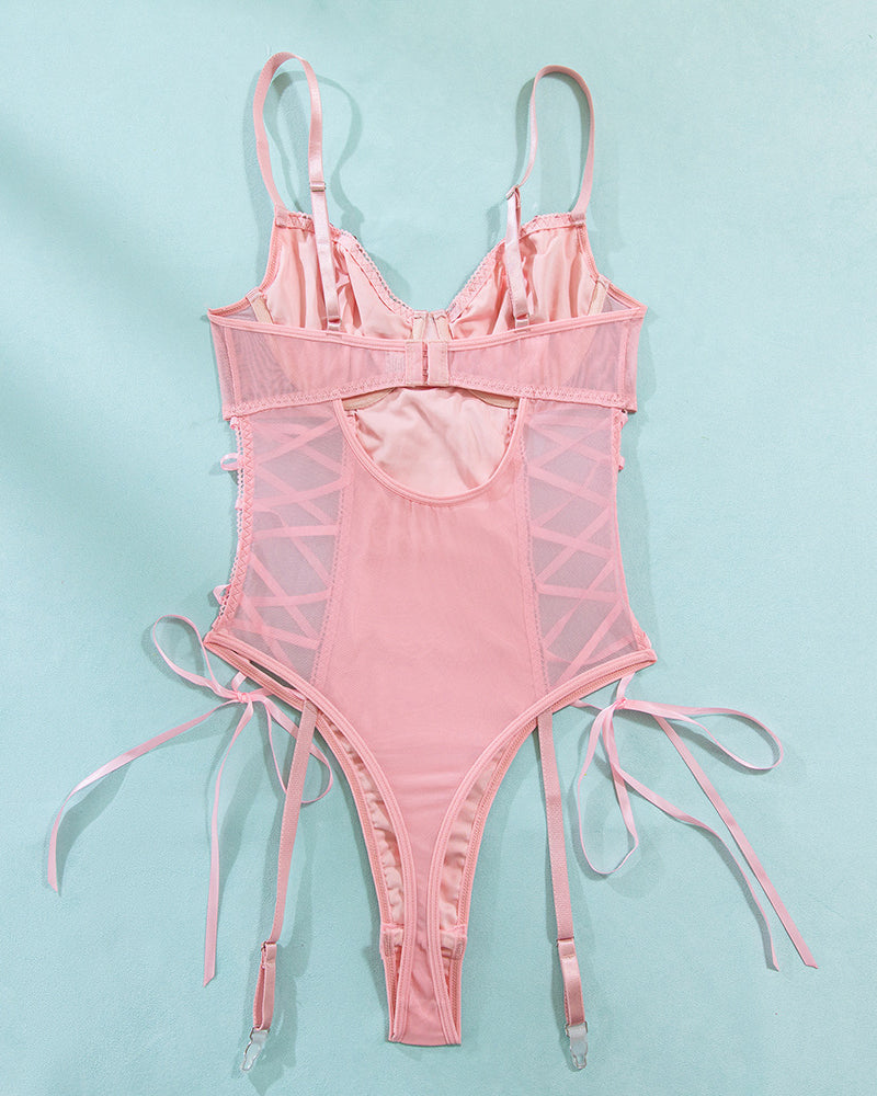 Pink mesh erotic bodysuit with adjustable straps and lace-up details, highlighting feminine charm.