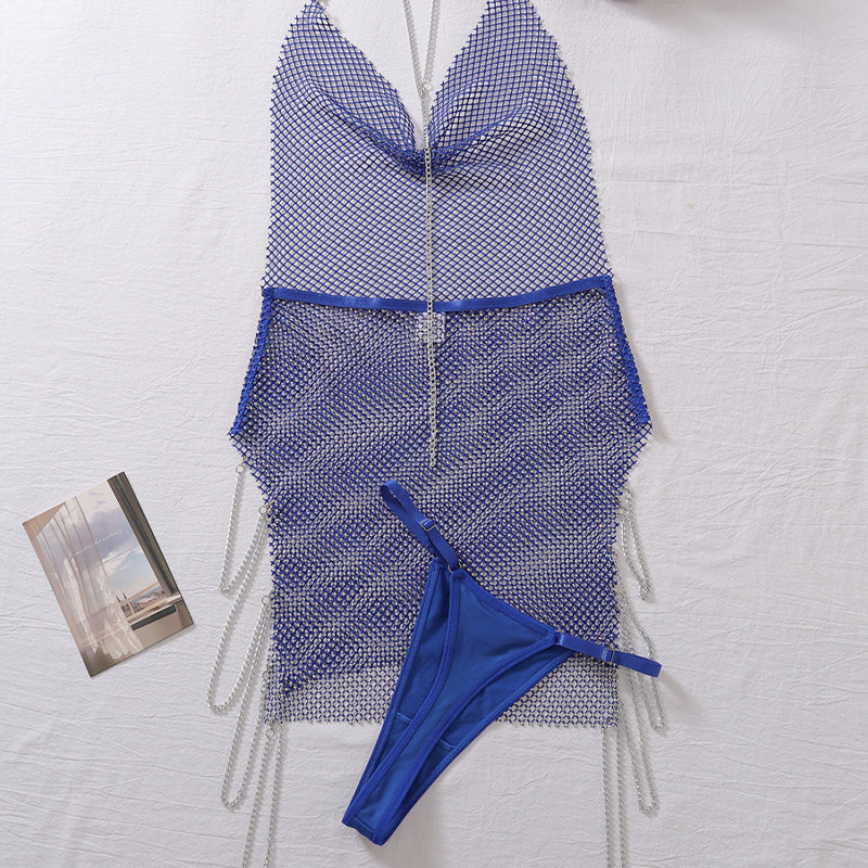Blue rhinestone mesh chemise with thong, halter neckline and fringe chain ties, flat lay