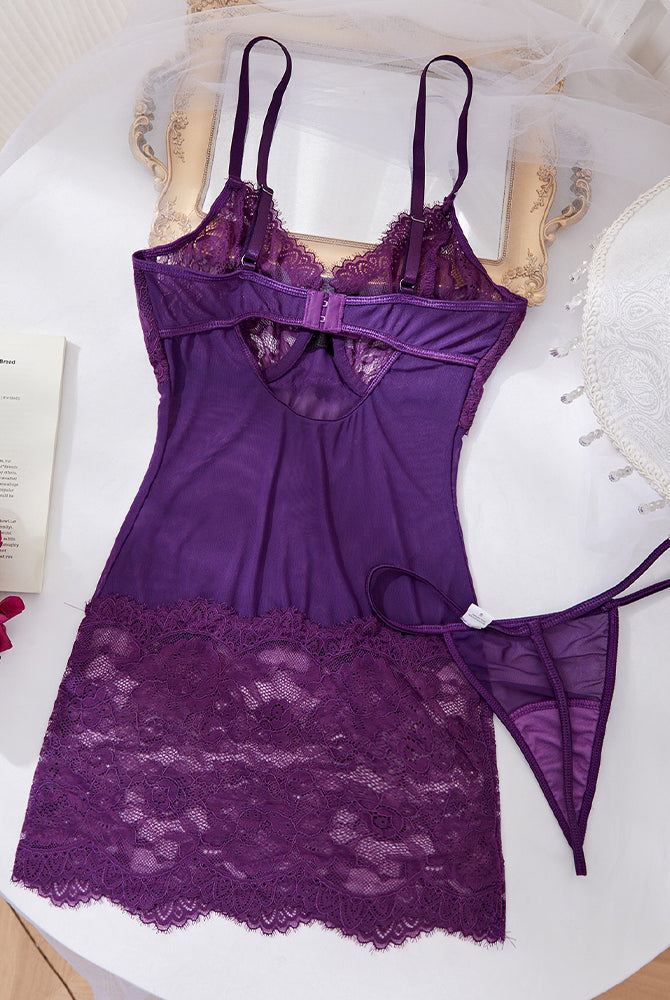 Purple lace slip dress with adjustable straps and matching thong, laid flat