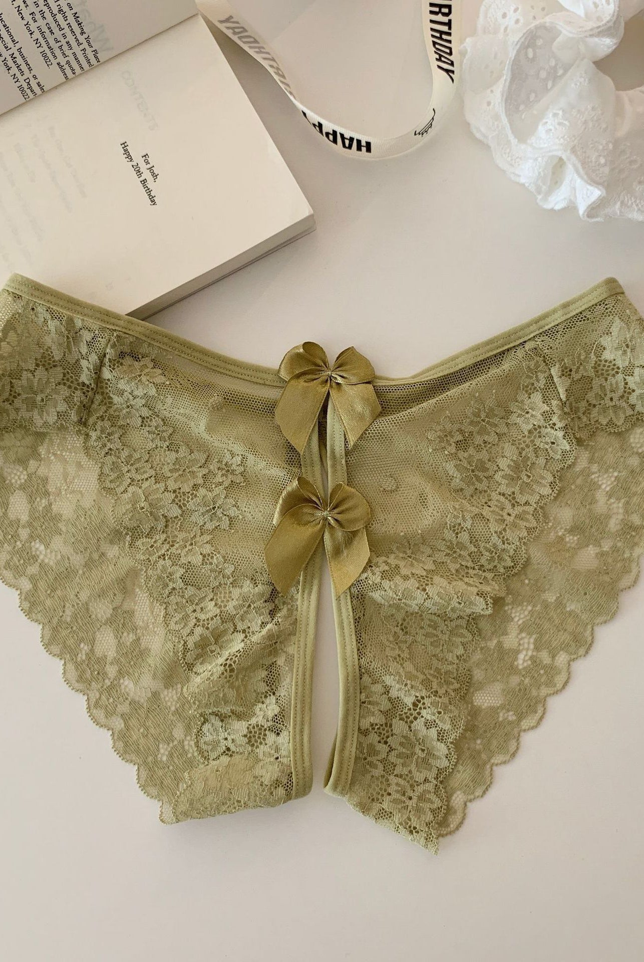 Olive sheer floral lace panties with scalloped edges and tied back bow detail