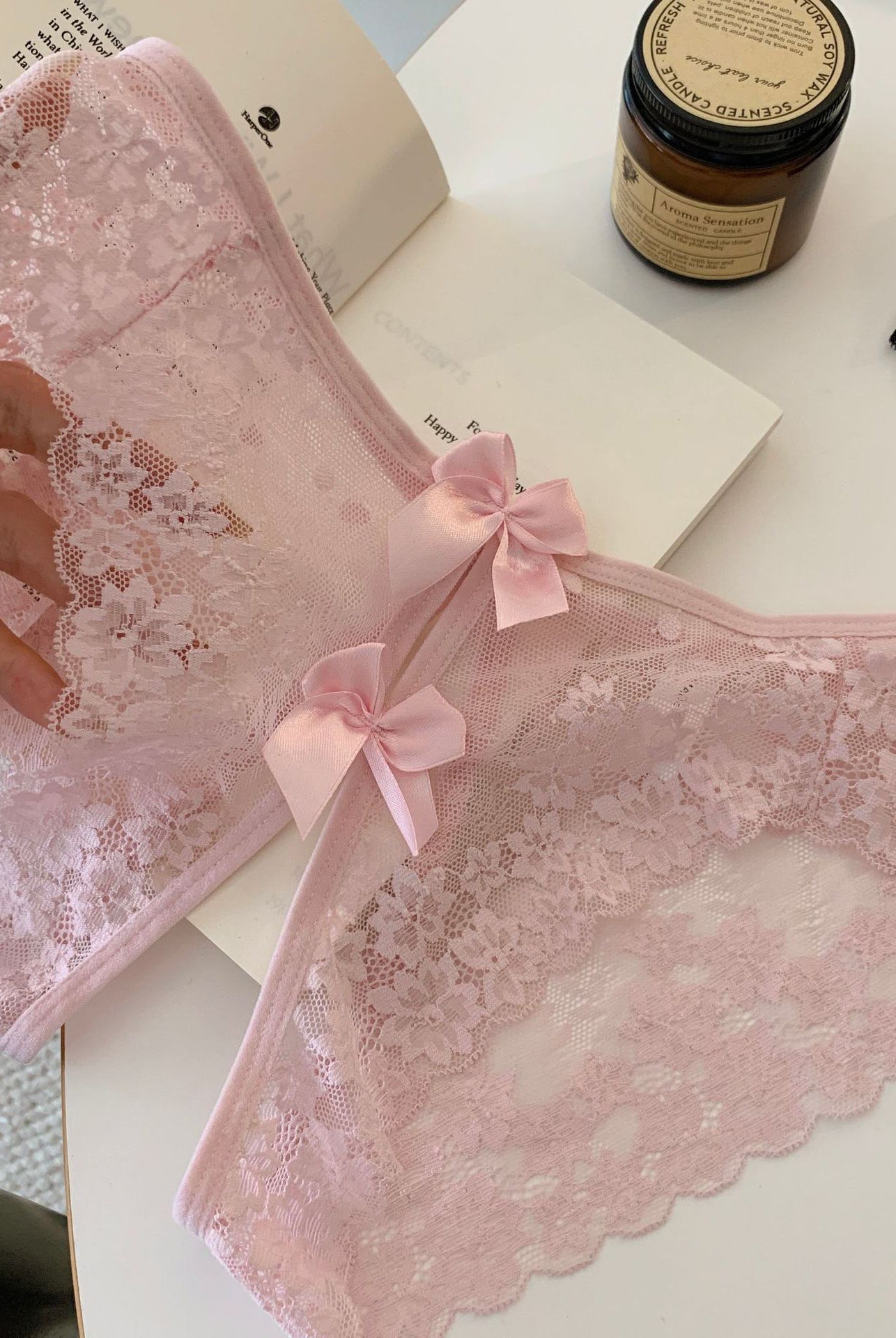 Pink sheer floral lace panties with scalloped edges and bow-back ties