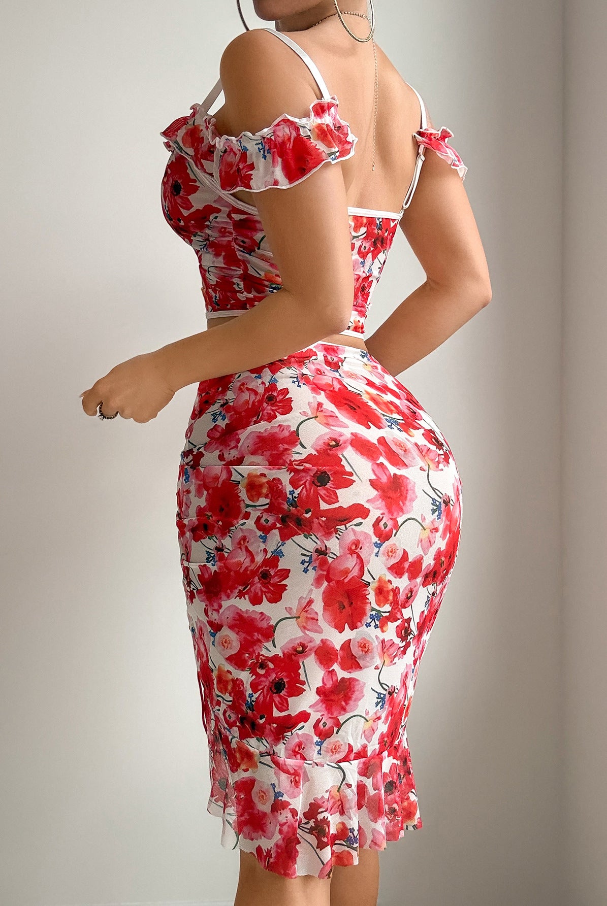 Red floral mesh crop top with ruffle sleeves and ruched mini skirt