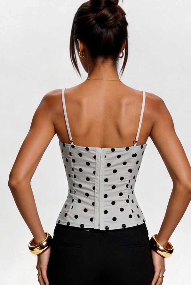 White polka-dot corset crop top, back view, thin straps and buttoned panel