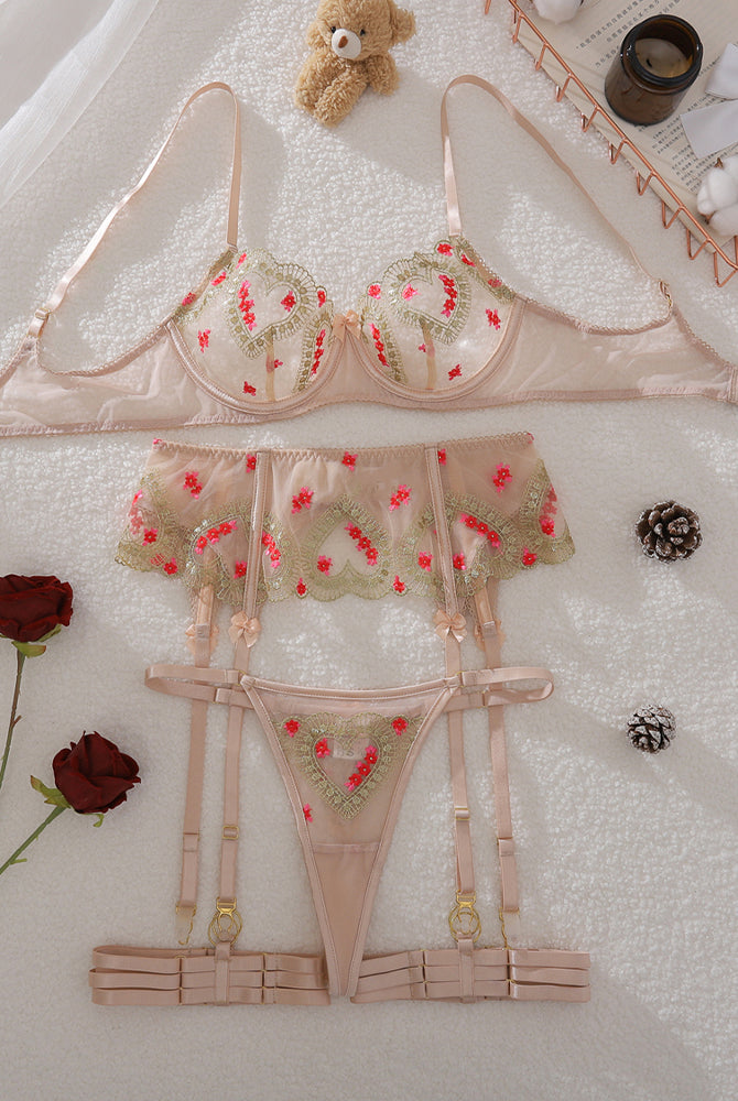Floral embroidered lingerie set with underwire bra, garter belt, and matching panties