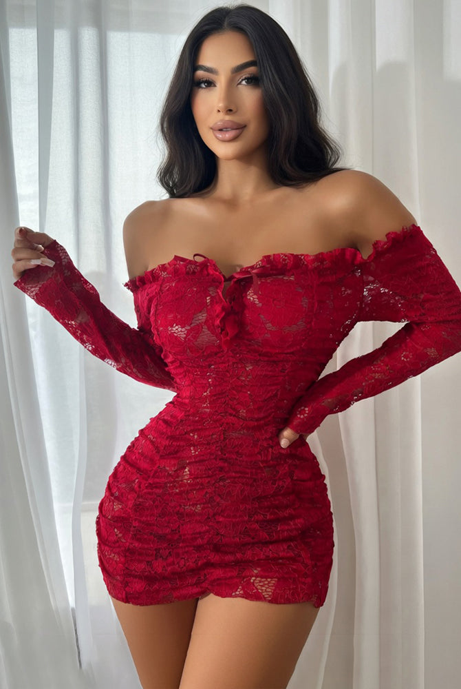Red off-shoulder lace mini dress with long sleeves and ruched bodycon silhouette.