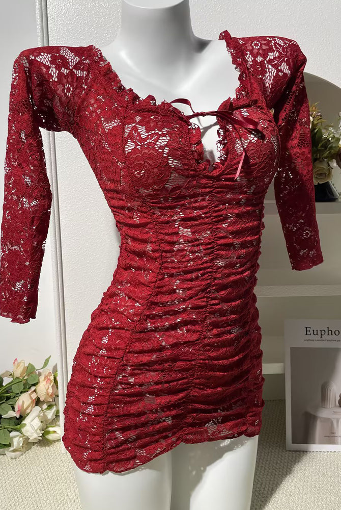 Red off-shoulder lace mini dress, long sleeves, ruched front, fitted bodycon silhouette.