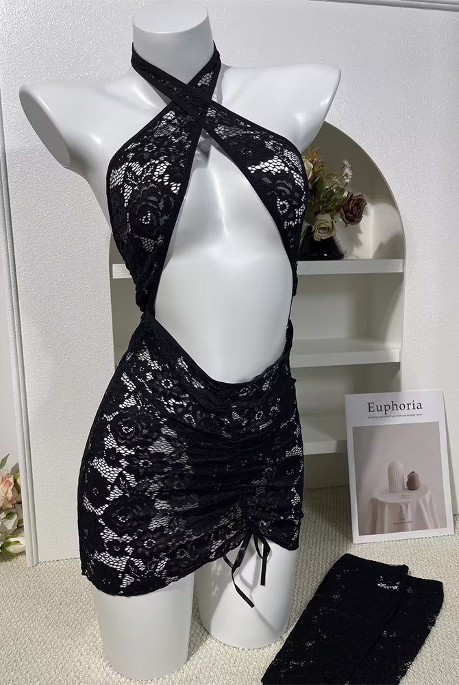 Black lace halter cutout bodycon dress on mannequin with open back and tie detail