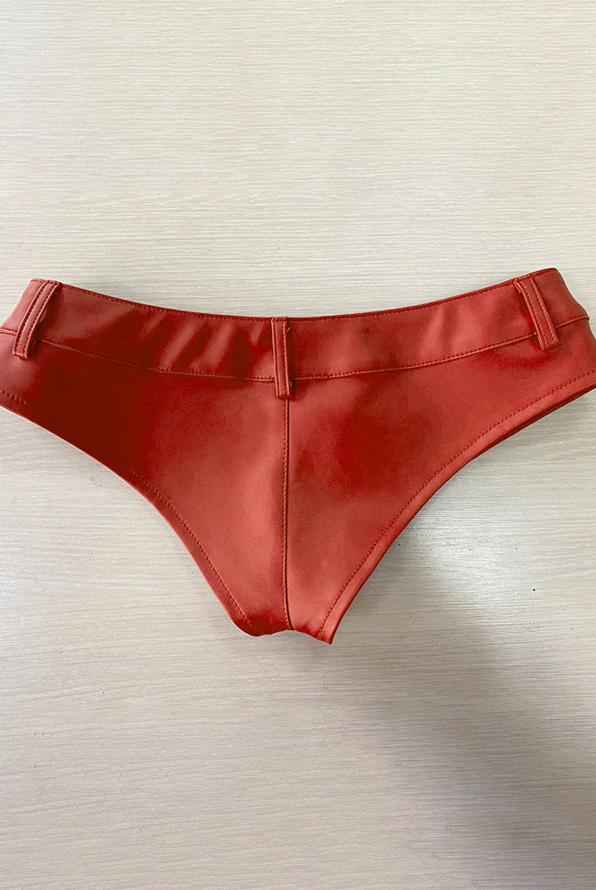 Red faux leather low rise booty shorts, flat lay with belt loops and seam detail