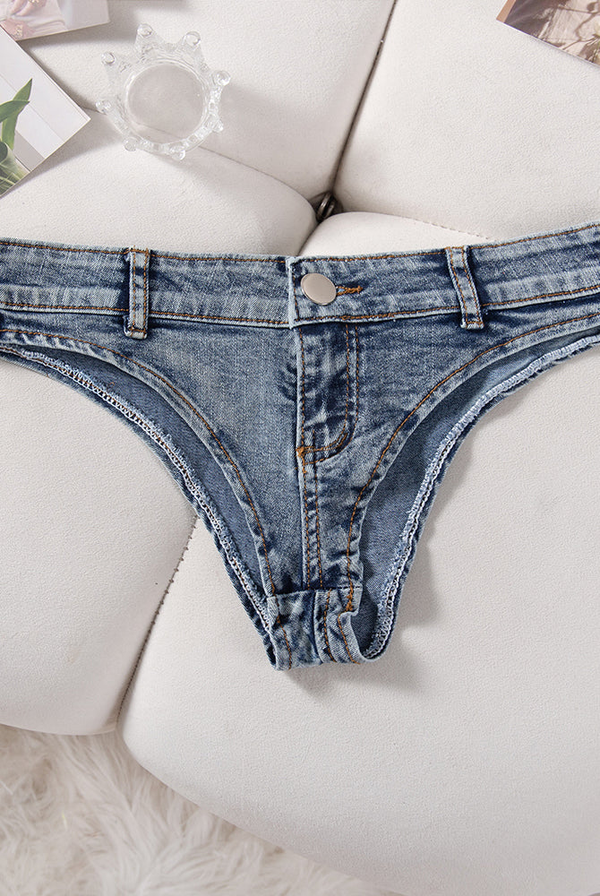 Low-rise denim thong panties in light blue, folded back view with button center