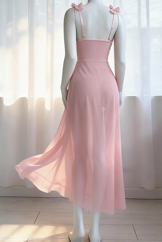 Pink satin and sheer maxi skirt set with bow straps, shown from back on mannequin