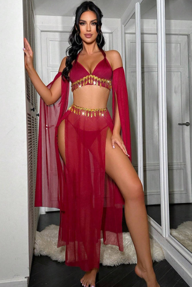 Red sheer halter bra with gold tassel chain, high-slit maxi skirt and arm sleeves