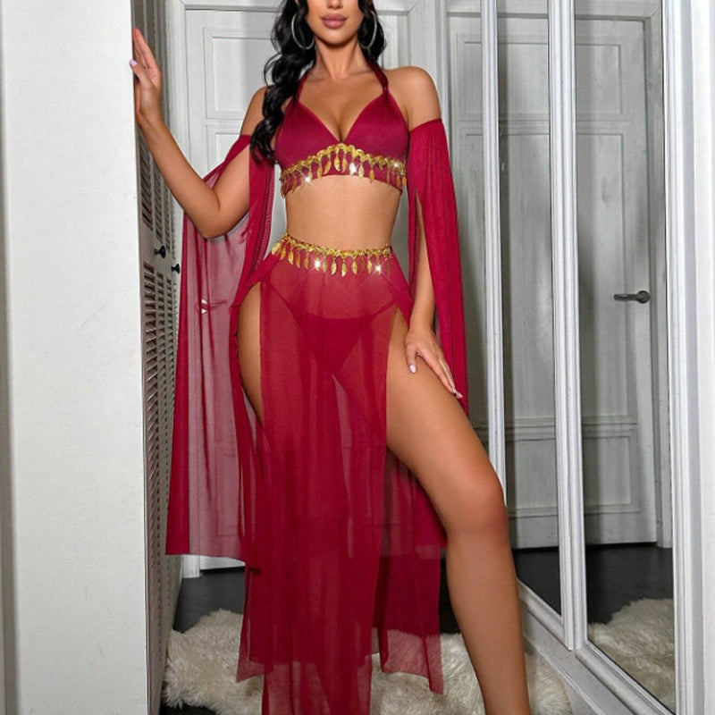 Red sheer halter bra with gold tassel chain, high-slit maxi skirt and arm sleeves