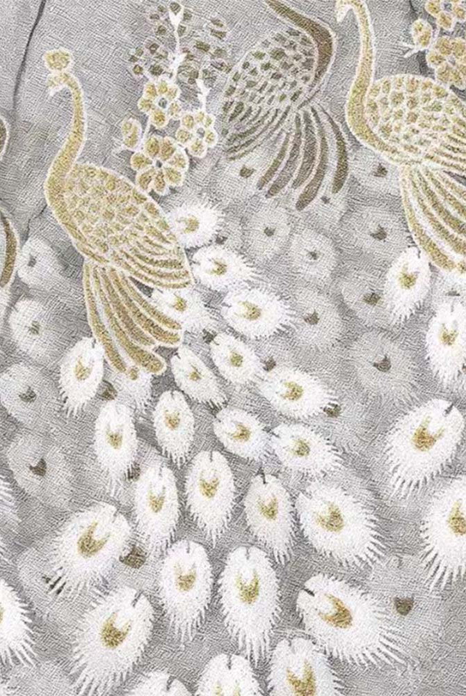 Embroidered sheer babydoll fabric panel with white and gold peacock feather motifs